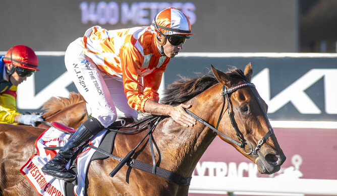 Jockey Billy Egan gives Western Empire a pat as they cross the line in the A$1.5 million Gr.3 Gold Rush (1400m) at Ascot in Perth on Saturday - Photo: Western Racepix