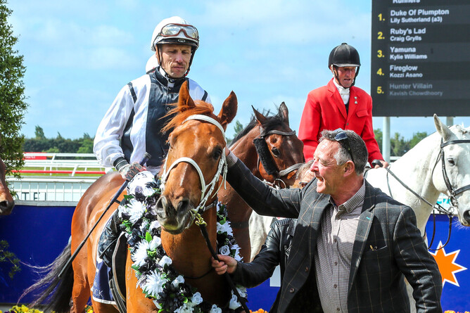Owner-trainer Sabin Kirkland welcomes back a victorious Buoyant and jockey Michael McNab after the Gr.3 Stewards Stakes (1200m) at Riccarton on Monday. - Photo: Race Images South