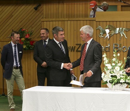 Nathan Guy and Ivan Bridge sign the biosecurity agreement at the Karaka Yearling Sales on Monday