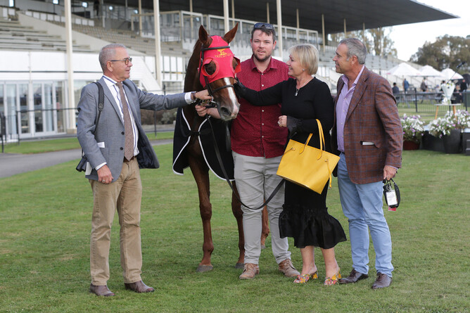 Along with co-trainer Roger James and strapper Zach I’Anson, Brent and Cherry Taylor show their affection for Two Illicit after her curtain-call win in the Travis Stakes. - Photo: Trish Dunell