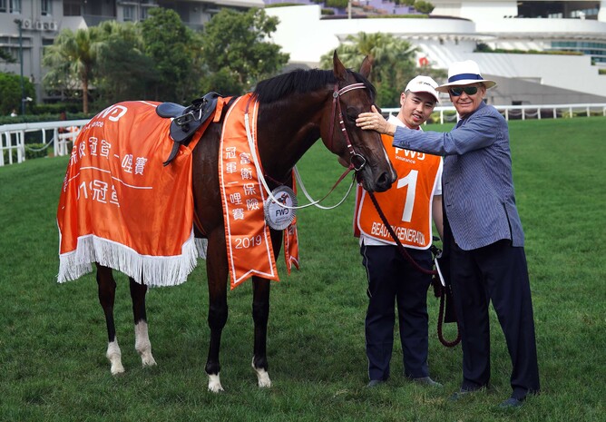 Beauty Generation with trainer John Moore and his strapper after he distanced his rivals in the Gr.1 Champions Mile (1600m) - HKJC