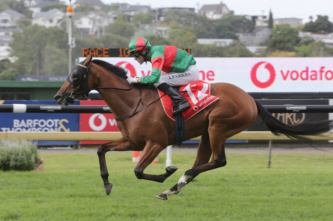 Johnathan Parkes guides Asterix to an upset victory in the Gr.1 Vodafone New Zealand Derby (2400m) at Ellerslie - Photo: Trish Dunell