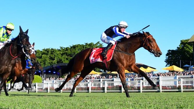 William Pike has Gypsy Goddess at full stretch as he takes out the Gr.1 Queensland Oaks (2200m) at Eagle Farm  - Photo: Trackside Photography – Grant Peters