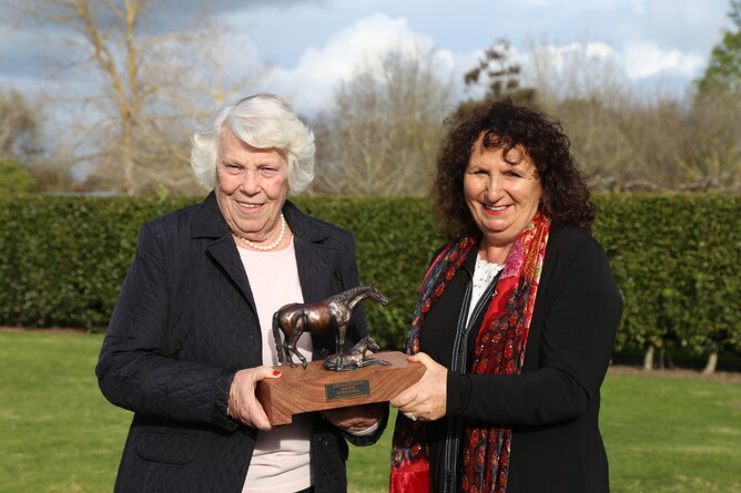 NZTBA councilor Michelle Saba presents Maire Leicester with the Broodmare of the Year trophy. Photo: Picket Fence