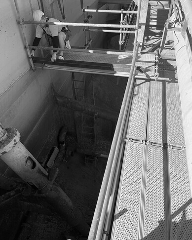 man constructing scaffolding