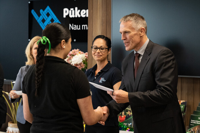 Former SWIFT Chairperson Stephen Veitch awarding Sariel Solomon a SWIFT Scholarship