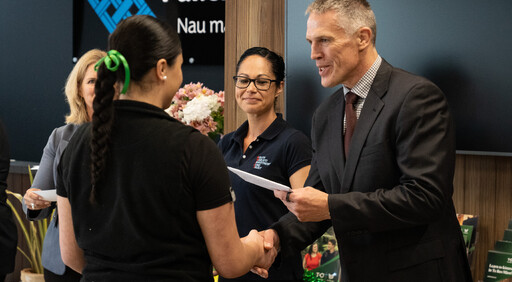 A scholarship recipient being awarded