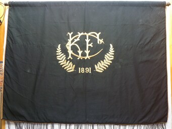 The historic banner of the 1891 Kūaotunu Football Club