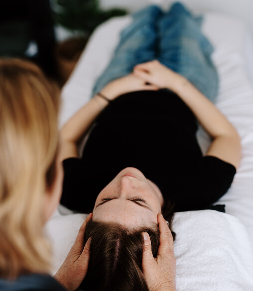 Image of Heather from Vital Body Therapy treating a client with Craniosacral Therapy. Cambridge clinic location, Waikato. New Zealand.