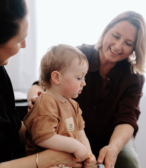 Image of Heather from Vital Body Therapy treating a young child with Craniosacral Therapy. Cambridge clinic location, Waikato. New Zealand.