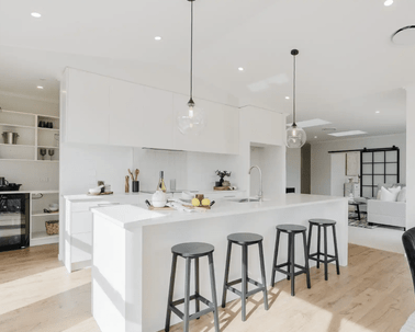 Image of light filled white washed modern kitchen with island bench in Collinson Street, Pirongia new home, by Waikato residential builders Whitechurch Construction Limited.