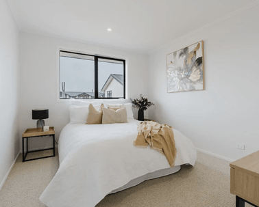 Image of natural light filled bedroom and soft neutral styling in Collinson Street, Pirongia new home, by Waikato residential builders Whitechurch Construction Limited.