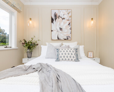 Image of newly renovated guest double bedroom in sand. Double bed styled in greys & white. Renovated by local Te Awamutu residential builders, Whitechurch Construction.