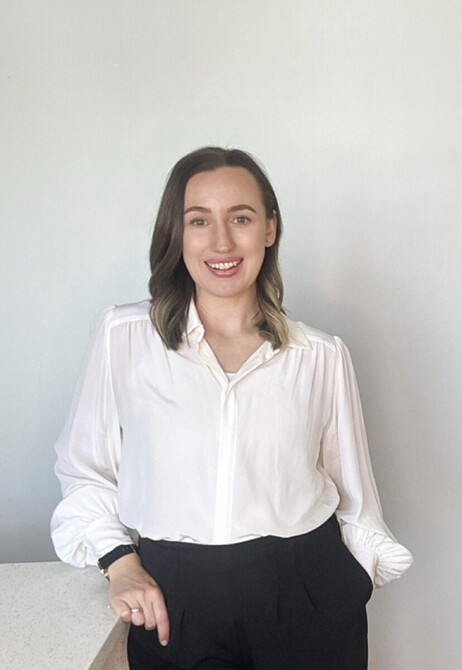 Nicole from AdminEdge smiling in a white blouse beside introductory copy about admin chaos and quoting at night.