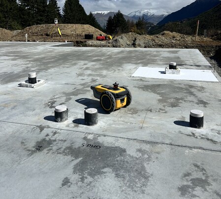 The PLS site print robot at work on a concrete slab.