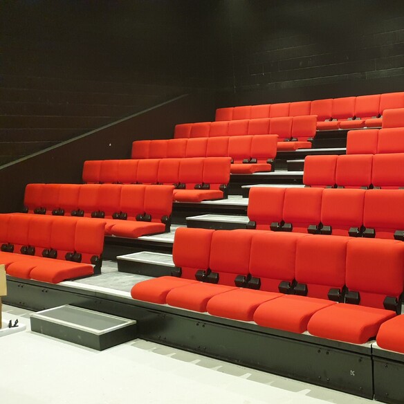 Covert Theatre - Retractable seating system with Merlot seat