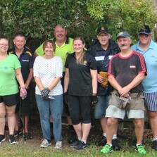 A group of Rotarian after a garden clean up