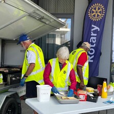 Rotarians in action at a sausage sizzle